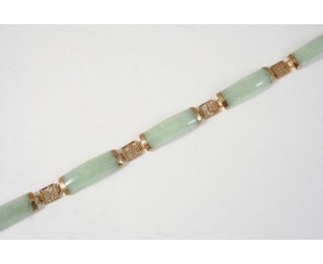 A JADE AND GOLD BRACELET formed with five rectangular-shaped panels of jade, in 9ct. gold, 19cm. long.