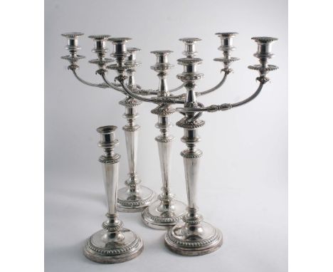 A SET OF THREE OLD SHEFFIELD PLATED THREE LIGHT CANDELABRA with round bases & tapering columns, crested, together  with a sin