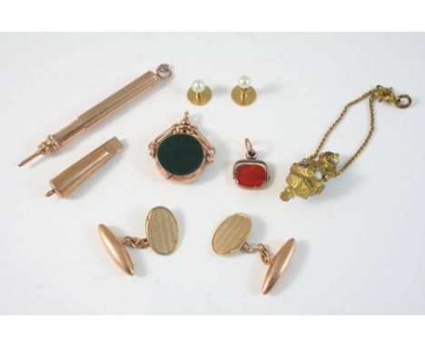 A PAIR OF 9CT. GOLD CUFFLINKS oval, with engine turned decoration, 6.6 grams, together with a 9ct. gold, bloodstone and carne