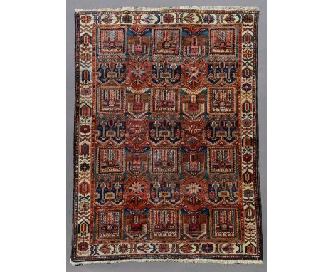 A BAKHTIARI PATTERN CARPET woven with bold tile pattern, generally good, 9ft. 8ins. (294cms.) x 7ft. 3 1/2ins. (227cms.)