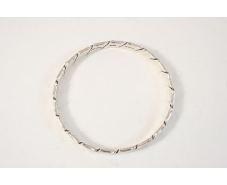 A SILVER BANGLE BY HANS HANSEN signed to the inside, 23 grams.