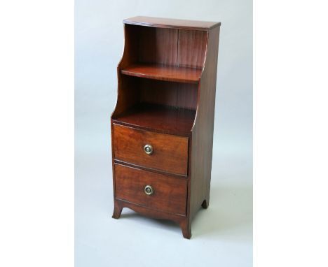 A MAHOGANY NARROW BOOKCASE the bow front with stepped upper part above two long drawers on splayed bracket feet, constructed 