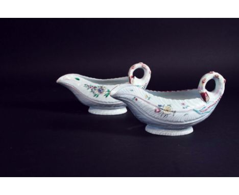 A PAIR OF FIRST PERIOD WORCESTER POLYCHROME LETTUCE LEAF SAUCE BOATS each naturalistically moulded body painted with floral s