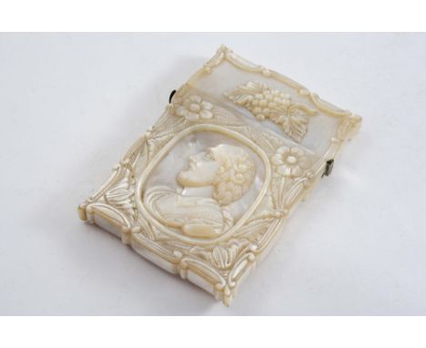 A MID 19TH CENTURY MOTHER OF PEARL CARD CASE of shaped oblong outline, carved on the front with a portrait medallion, floral 