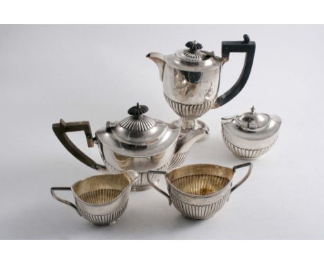 INDIAN COLONIAL: A late 19th /early 20th century small three piece part-fluted oval tea set, crested, by P.Orr & Sons, Madras