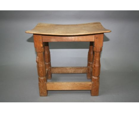 OAK 'MOUSEMAN' STOOL by Robert Thompson of Kilburn,an oak adzed stool with a curved top, carved Mouse signature. 16ins (40cms