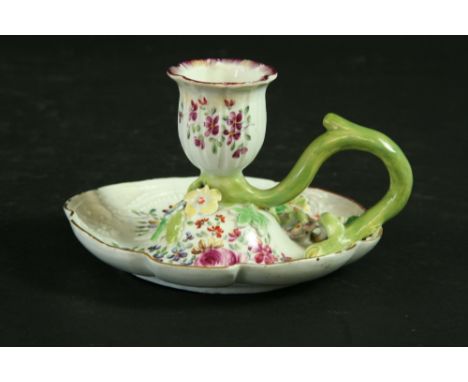 A DERBY CHAMBER CANDLESTICK the fluted pan moulded in low relief with scrolls and foliage, painted with floral sprays and app