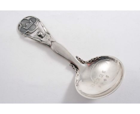 A NORWEGIAN CADDY SPOON with a figural stem & a raised inscription, with "NORGE 1945" in the centre of the bowl, maker's mark