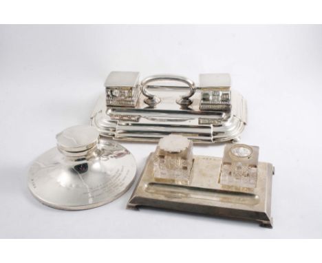 A VICTORIAN TWO BOTTLE INKSTAND with a rounded oblong base & central handle, inscribed, by Edward Hutton, London 1888 togethe