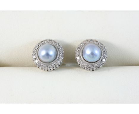 A PAIR OF CULTURED PEARL AND DIAMOND CLUSTER EARRINGS each set with a grey cultured pearl within a surround of circular-cut d