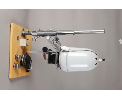 A Photographic Enlarger, possibly by Gnome, for negatives up to 6 x 9cm, baseboard 46 x 38cm approx, no lamp with two Wray Su