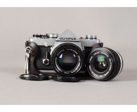 An Olympus OM-1N SLR Camera, serial no 1636013, shutter working, meter reponds to light, condition VG, with Zuiko MC Auto-S 5