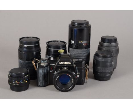 A Minolta 7000 AF SLR Camera and Lenses, the Minolta AF lenses include a 50mm f/1.7 lens, a 28-135mm f/4-4.5 lens, a 35-105mm