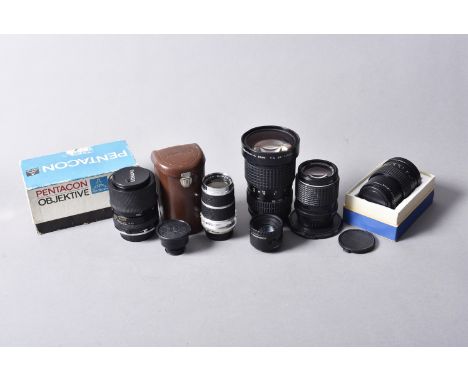 A Group of SLR Lenses, including a SMC-Pentax A 28-135mm f/4, a SMC-Pentax-M 135mm f/3.5, a Carl Zeiss Jena Prakticar 135mm f