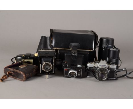 A Collection of Various Film Cameras, including an Olympus OM-10 SLR, stuck on self-timer, with 50mm f/1.8 lens, a Zeiss Ikon