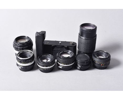 A Group of Nikon SLR Lenses, a Nikkor 50mm f/1.4 lens, a Nikkor-H Auto 50mm f/2 lens, a Nikkor-H Auto 85mm f/1.8 lens, a Seri