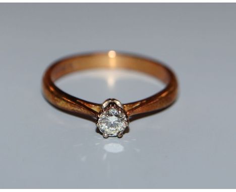 A modern 18ct gold and diamond solitaire ring, size N.