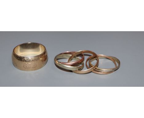 A 'Russian' 9ct three colour gold wedding ring, one other unmarked 'Russian' ring and a modern 9ct gold wedding band.