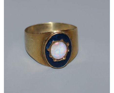 A George III yellow metal, white opal and enamel mourning ring, for John Bell, 1807, (opal later mounted?), size O.