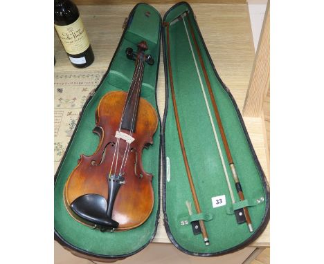 A Violin with label 'Antoins Stradivarius Cremona fecit Anno 1600' in Boosey and Hankey case with two bows