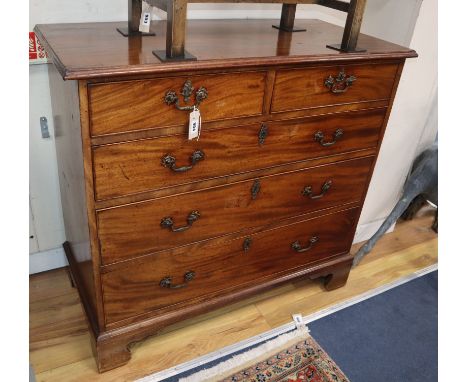 A George III mahogany chest fitted two short drawers and three long drawers on shaped bracket feet, with original gilt brass 