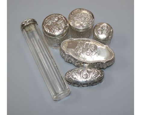 An Edwardian repousse silver trinket box, Birmingham, 1905 and five assorted silver mounted glass toilet jars.