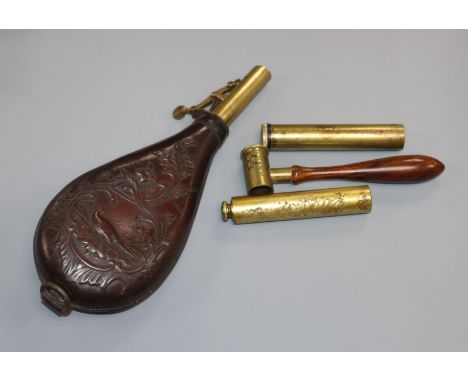 A leather powder flask and three other items