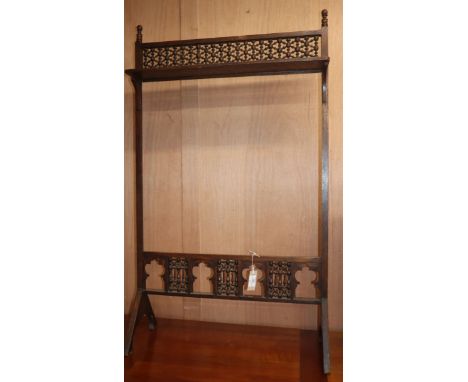 A Liberty &amp; Co style oak firescreen frame W.70cm