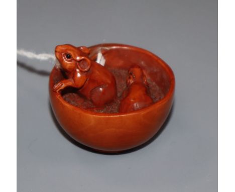 A carved wood netsuke, signed