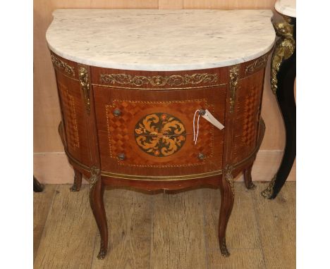 A Louis XVI style marquetry inlaid marble top bow front side cabinet W.70cm