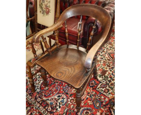 A Victorian elm and beech smokers bow chair