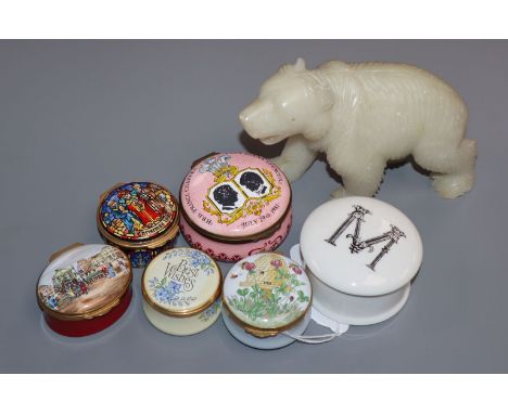 A collection of enamel pill boxes and a soapstone carved bear