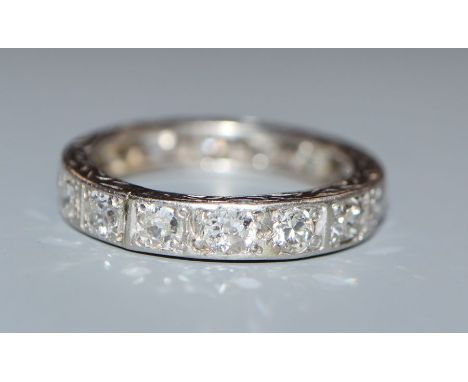 A white metal and diamond set full eternity ring, size alteration, size K/L.