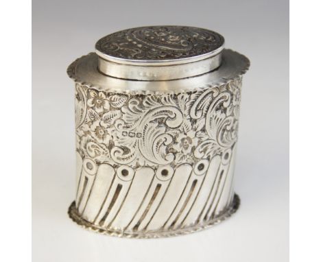 A George V silver tea caddy, William Hutton & Sons, Sheffield 1918, of oval form with waved borders, half-reeded body with fl