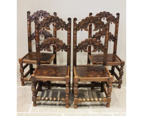 A set of four 17th century style oak and elm Derbyshire chairs, 20th century, each chair with twin arched and scalloped rails