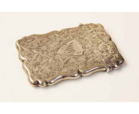 An Edwardian silver card case, W G Keight & Co, Birmingham 1901, of shaped rectangular form, scrolling foliate decoration to 