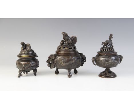 A Japanese bronze koro and cover, Meiji period (1868-1912), the compressed globular body raised on three supports and decorat