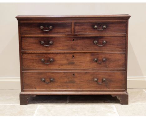 A George III mahogany chest of drawers, the rectangular moulded top above an arrangement of two short and three long graduate