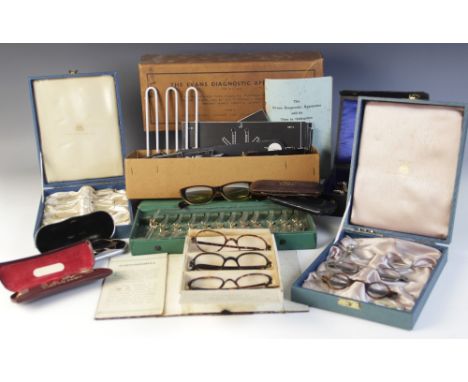 A collection of vintage optician's equipment, including; 25+ pairs of spectacles (including eight Rest-Lite tester pairs), th
