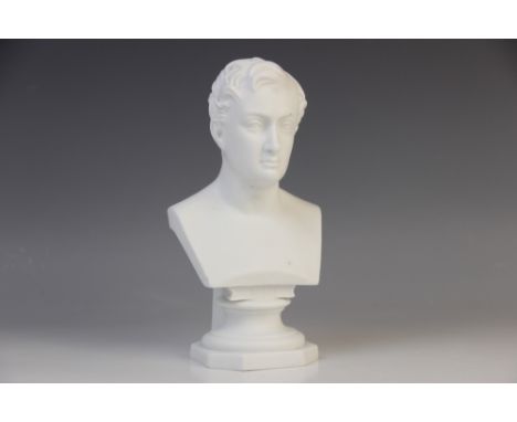 LORD BYRON: An English bisque porcelain bust of Lord Byron, early 19th century, modelled with bare torso set above a rectangu