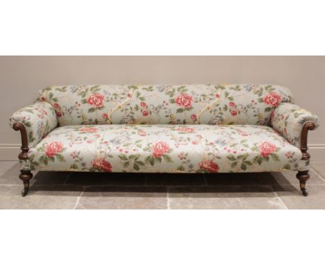 A Victorian Howard type sofa, upholstered in Morris & Co 'Tangley' fabric on an eggshell ground, the padded scrolled arms ext