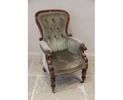 A Victorian mahogany framed drawing room chair, in green velour, the shaped and button back extending to padded arms with car