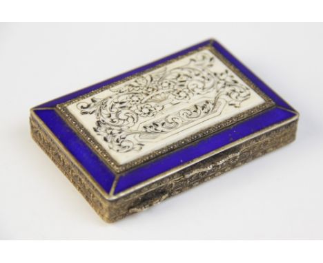 A continental silver gilt and enamel minaudière, of rectangular form, the cover set with an engraved ivory panel with a blue 