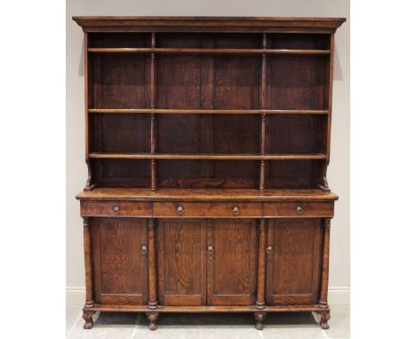 A mid 19th century elm dresser, possibly French, the high back with a moulded cornice over three open shelves united by ring 