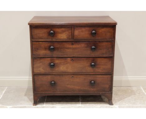 A George III mahogany chest of drawers, the rectangular top with a reeded edge over an arrangement of two short and three lon