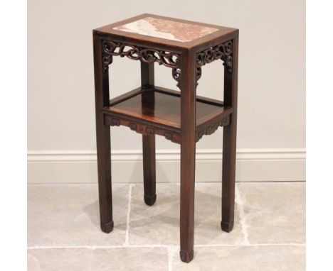 A Chinese hardwood and marble nightstand, early 20th century, the rectangular top inset with a rouge marble slab, above a scr