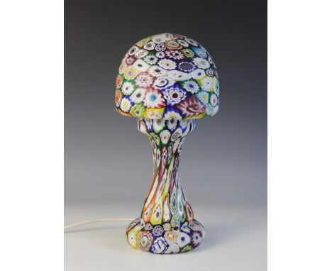 A Murano style millefiori caneware table lamp, mid 20th century, the mushroom shade raised on a baluster stem on bun foot, 34