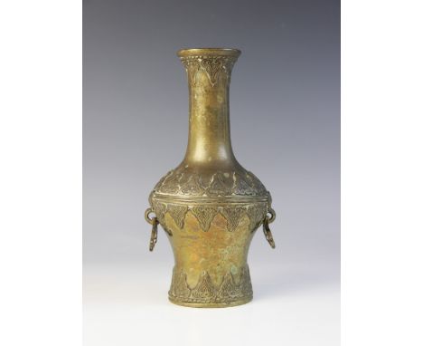 A Chinese bronze baluster vase, early 20th century, in the archaic manner with two reticulated ring handles, 19cm high 