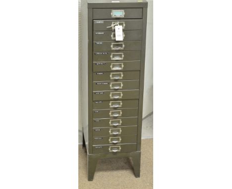 A Vintage green painted filing cabinet, fifteen narrow shallow drawers, 29cms wide.