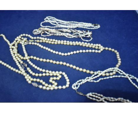 Cultured and other pearl necklaces, including coloured baroque, and others faux.